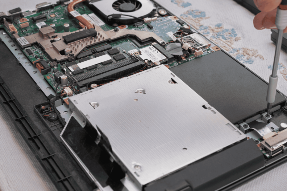 Image of person repairing a MacBook at FixMyMac - Affordable MacBook Repair Services in Malaysia at Kuala Lumpur & Selangor Area